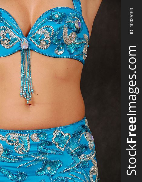 Belly-dancer in traditional turquoise blue attire. Belly-dancer in traditional turquoise blue attire