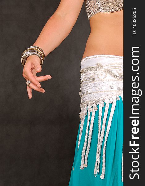 Belly-dancer in traditional turquoise blue attire. Belly-dancer in traditional turquoise blue attire