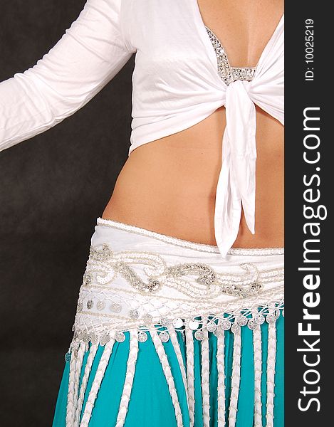 Belly-dancer in traditional turquoise blue attire. Belly-dancer in traditional turquoise blue attire