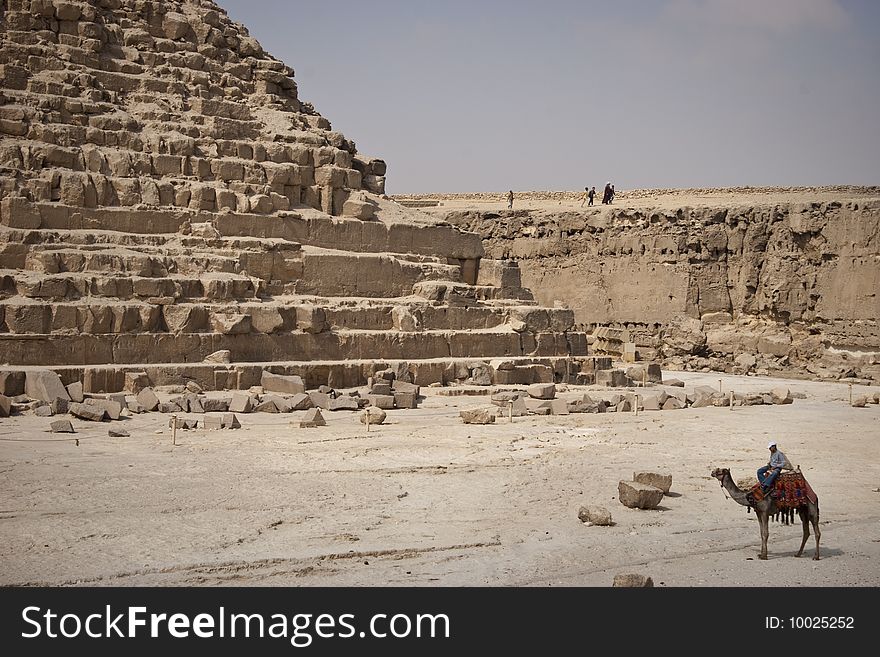 The Pyramid of Khafrae is the second largest of the Ancient Egyptian Pyramids of Giza and the tomb of the fourth-dynasty pharaoh Khafre (Chephren in Greek), The pyramid has a base length of 215.25 m (706 ft) and originally rises to a height of 143.5 m (471 ft). The Pyramid is made of Limestone blocks (weighing more than 2 tons each). The slope of the pyramid rises at an 53� 10' angle, steeper than