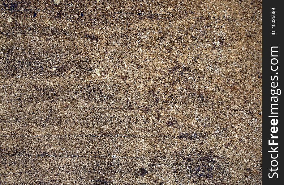 This is a close up photo of a dirty section of concrete. This is a close up photo of a dirty section of concrete