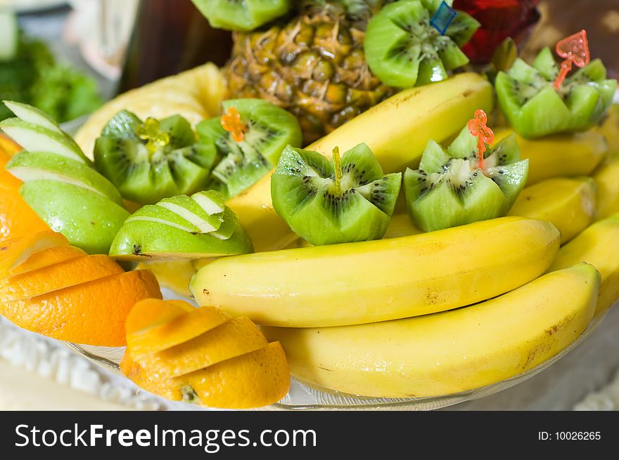 Tropical fruit on a vase for a dessert. Tropical fruit on a vase for a dessert.