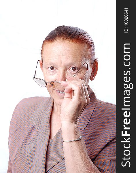 Middle aged woman is holding her glasses. Middle aged woman is holding her glasses