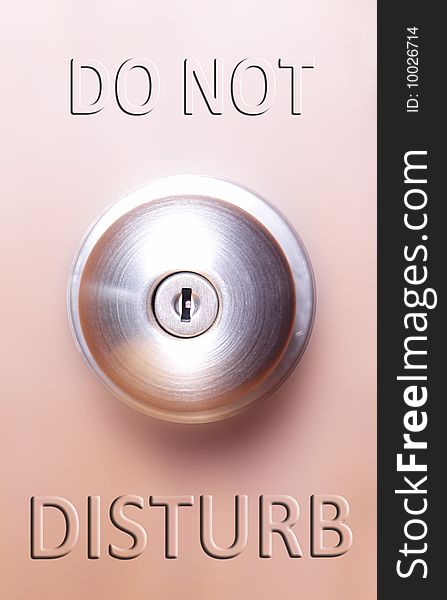 Chrome lock over wooden surface with do not disturb text. Chrome lock over wooden surface with do not disturb text