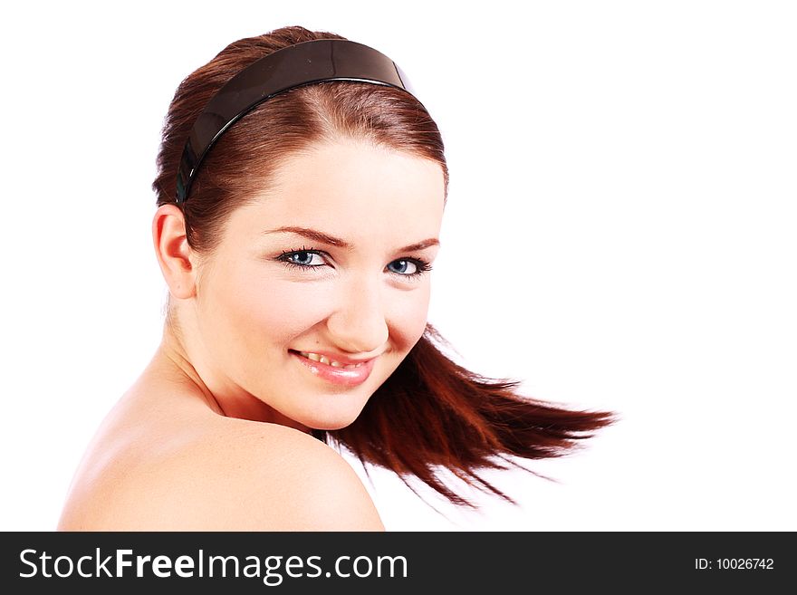 A beautiful young woman turning her head toward the camera and smiling. A beautiful young woman turning her head toward the camera and smiling.