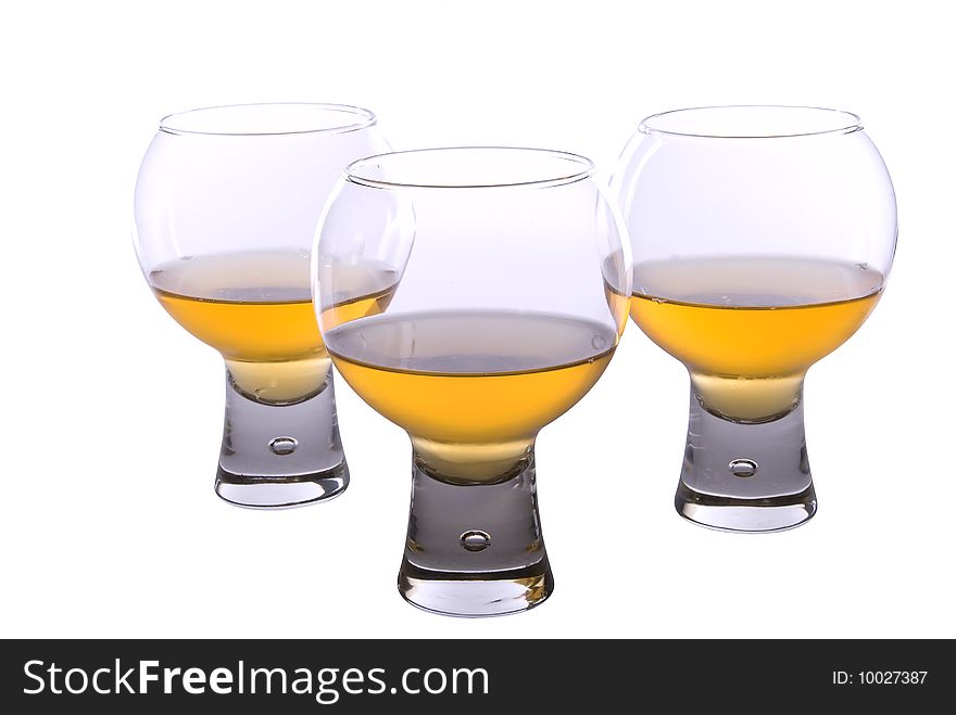 Set of three cognac glasses on white background