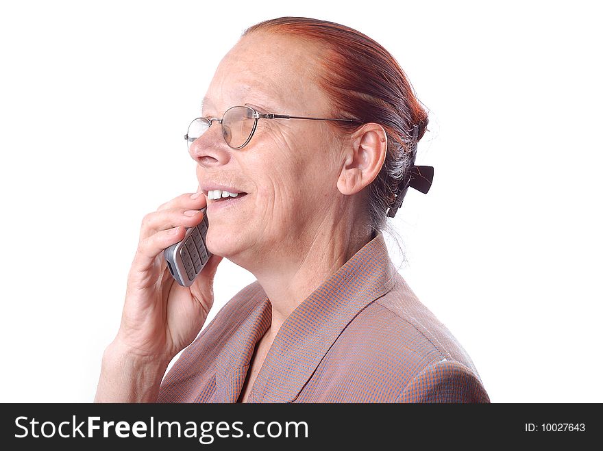 Middle aged woman is speaking on phone. Middle aged woman is speaking on phone