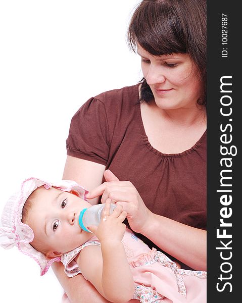 White mother is feeding her little baby. White mother is feeding her little baby