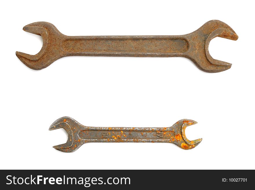 Old rusty double open-end wrenchs on a white background. Old rusty double open-end wrenchs on a white background.