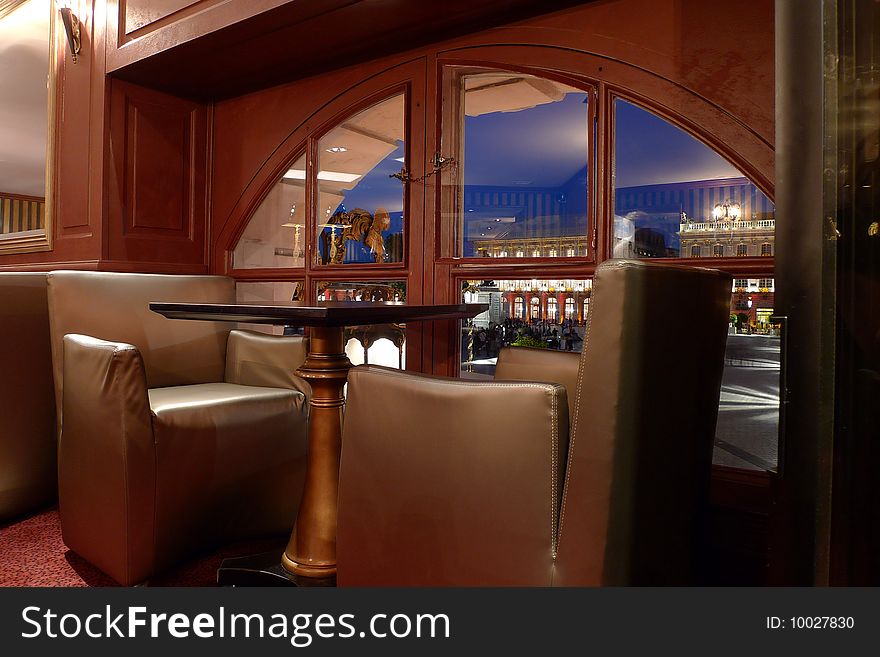 Armchairs and table near a window in a restaurant. Armchairs and table near a window in a restaurant