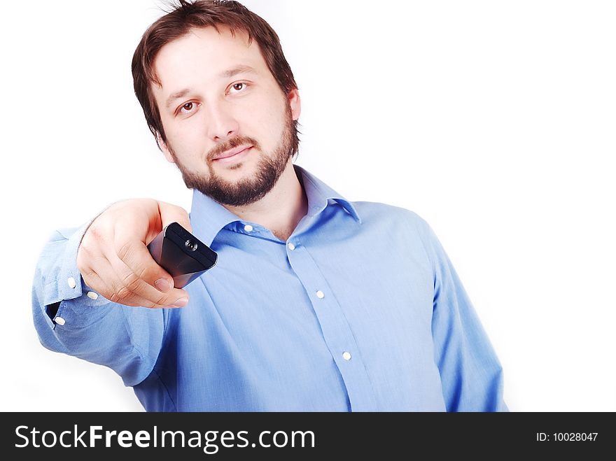 Man is holding remote control and looking in front of him. Man is holding remote control and looking in front of him