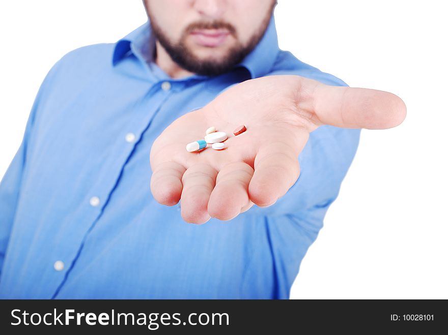Man is offering medical pills on his palm. Man is offering medical pills on his palm