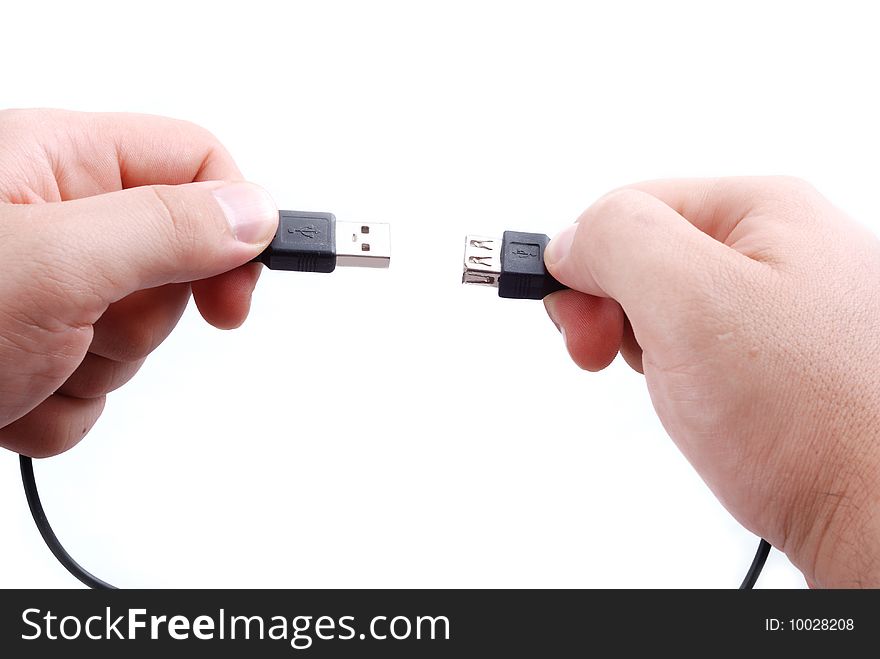 Usb cabel between plug and play in hands. Usb cabel between plug and play in hands