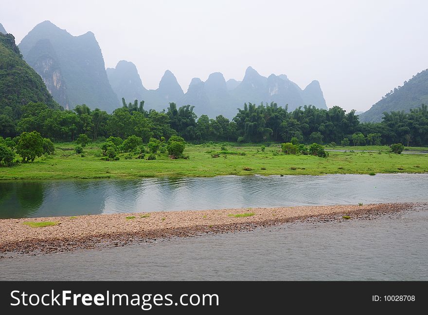 Mountains,bamboo,green grassland,river and sand. Mountains,bamboo,green grassland,river and sand.