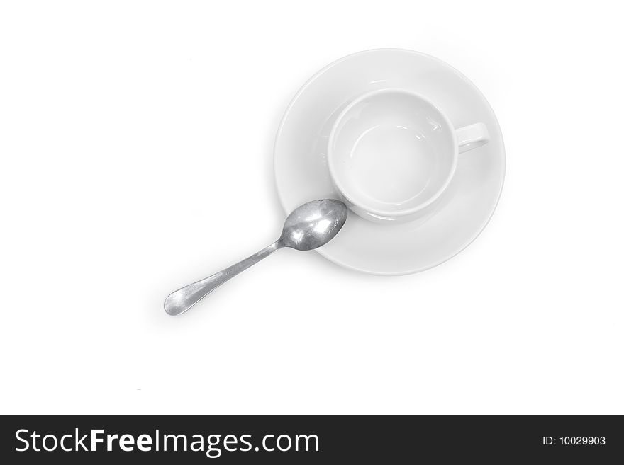 in the picture depicts a cup, saucer and spoon. in the picture depicts a cup, saucer and spoon