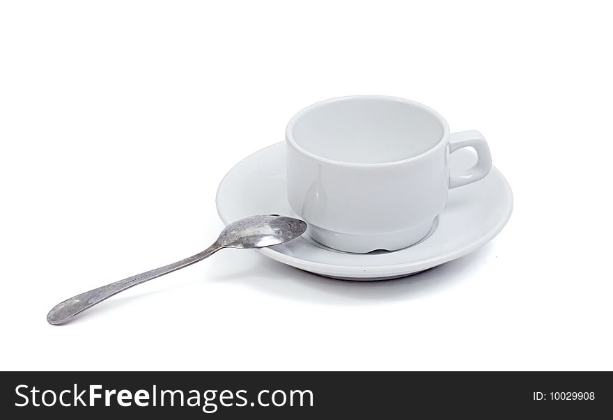 In the picture depicts a cup, saucer and spoon. In the picture depicts a cup, saucer and spoon