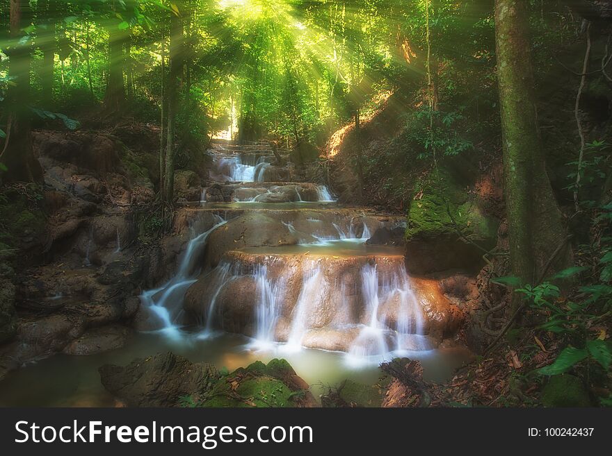 Dreammy waterfall with sunray for background.