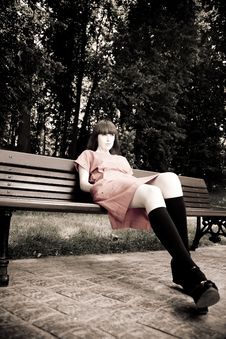 Pretty Woman Sitting On A Bench Royalty Free Stock Photography Pretty Woman Sitting On A Bench Royalty Free Stock Photography