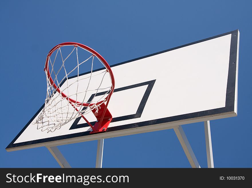 Basketball hoop over a blue sky