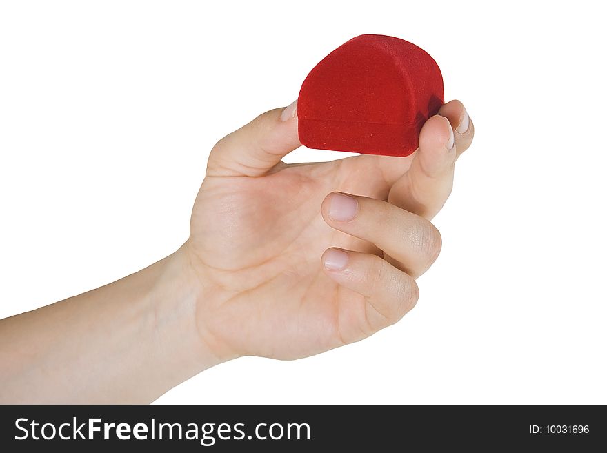 Man's hand holding small red box with gift
