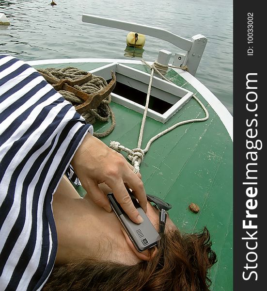 Woman chat on boat in marine dress. Woman chat on boat in marine dress