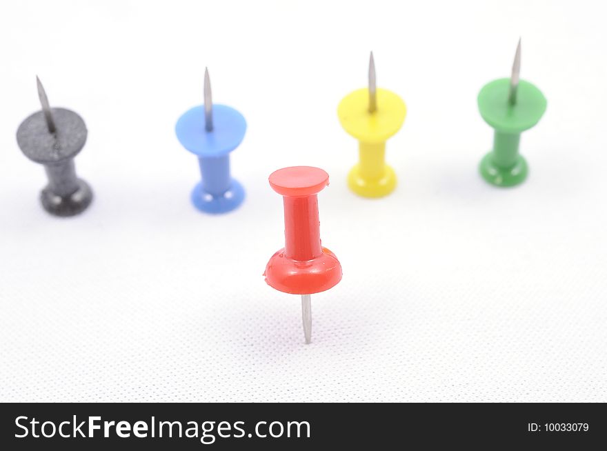 A set of color pins on white background. A set of color pins on white background