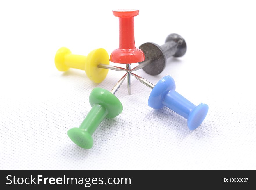 A set of color pins on white background. A set of color pins on white background