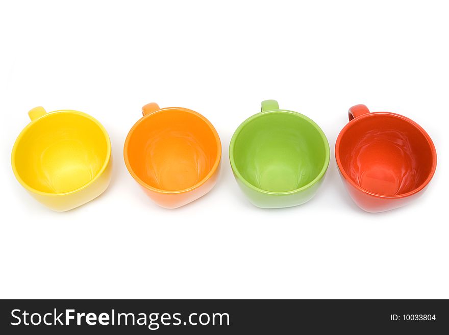 Four multicolor cups on a white backround