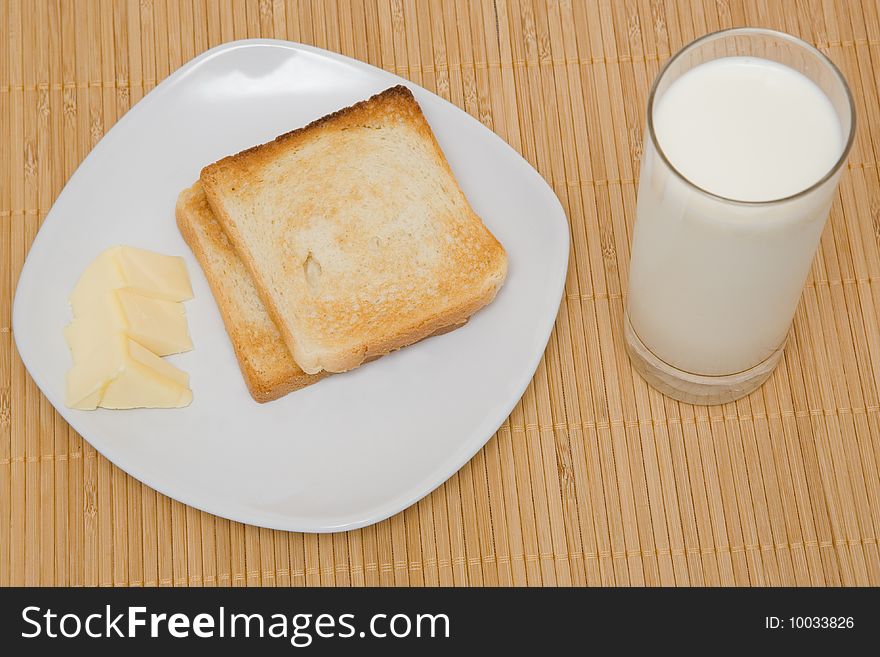 Toasts and butter on a bamboo mat