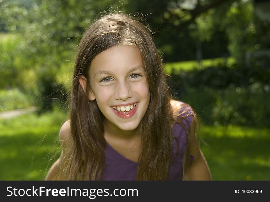 Close up face of pretty girl smiling and putting her face closer to camera