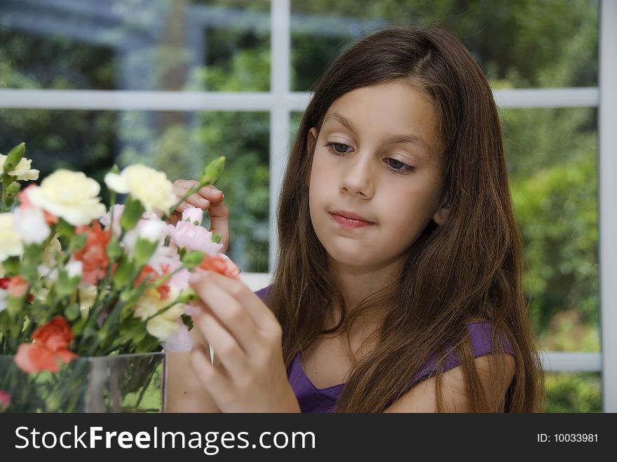 Close up of pretty girl who playing with flower. Close up of pretty girl who playing with flower