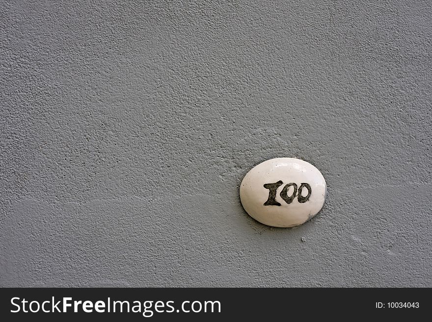 Number 100 on a wall