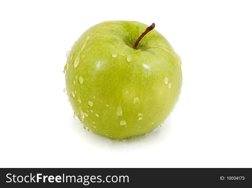 Green apple with droplets isolated on a white background