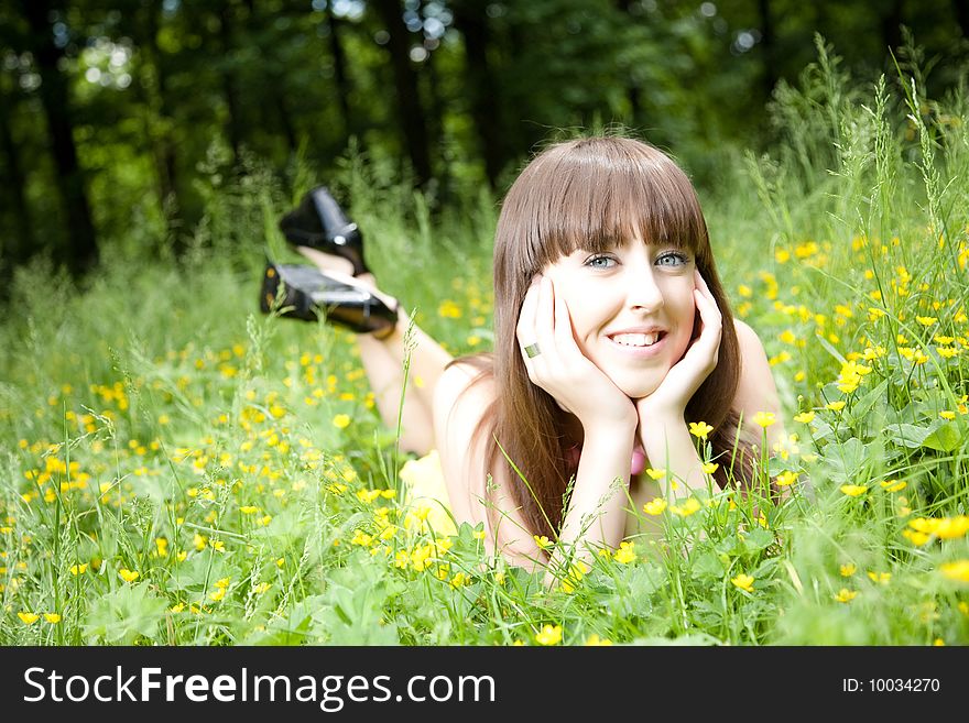 Beauty Young Woman Resting On The Meadow. Beauty Young Woman Resting On The Meadow