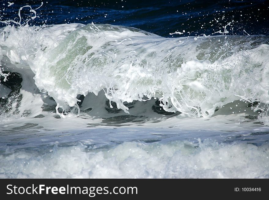 Ocean waves crashing onto shore. Ocean waves crashing onto shore