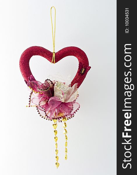 A red decorative heart with accessories. A red decorative heart with accessories
