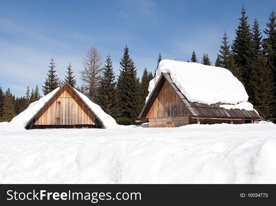 Wooden Cabins in the Snow