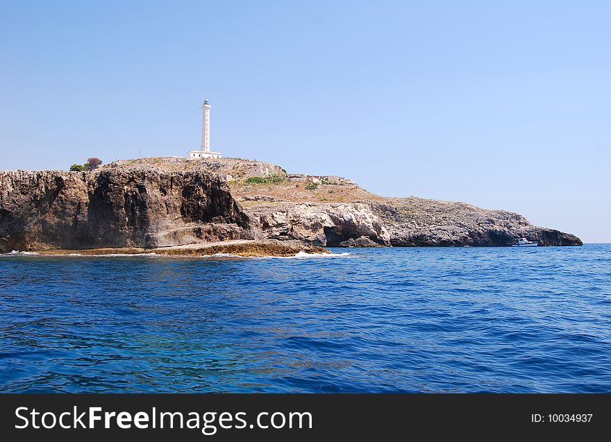 Lighthouse on rocks on the sea