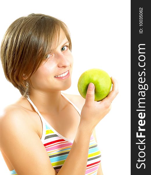 Portrait of a young pretty Caucasian blond woman with a nice colorful striped dress who is smiling and she is holding a green apple in her hand. Isolated on white. Portrait of a young pretty Caucasian blond woman with a nice colorful striped dress who is smiling and she is holding a green apple in her hand. Isolated on white.