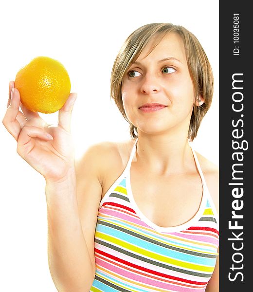 Portrait of an attractive Caucasian blond girl with a nice colorful striped dress who is smiling and she is holding a fresh orange in her hand. Isolated on white. Portrait of an attractive Caucasian blond girl with a nice colorful striped dress who is smiling and she is holding a fresh orange in her hand. Isolated on white.