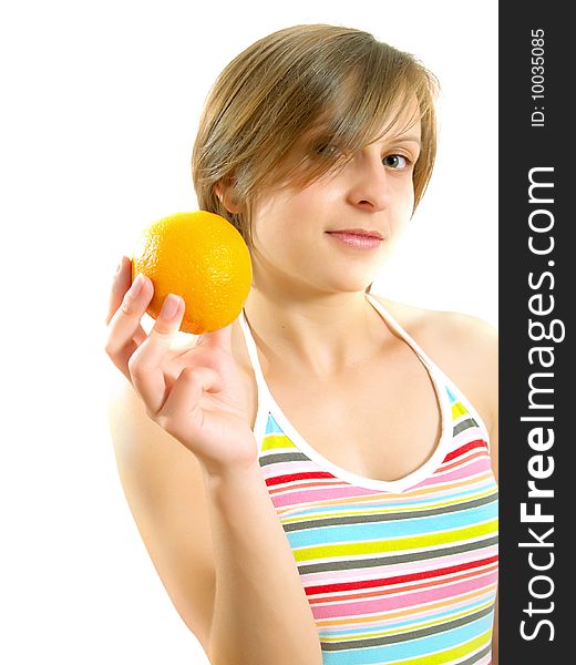 Portrait of a cute Caucasian blond girl with a nice colorful striped summer dress who is smiling and she is holding a fresh orange in her hand. Isolated on white. Portrait of a cute Caucasian blond girl with a nice colorful striped summer dress who is smiling and she is holding a fresh orange in her hand. Isolated on white.