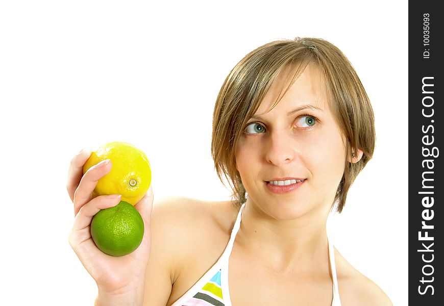 Cute girl holding lemon and lime