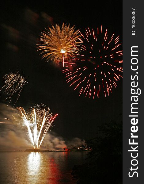 Fireworks display reflected over the waters of Long Island Sound. Fireworks display reflected over the waters of Long Island Sound.