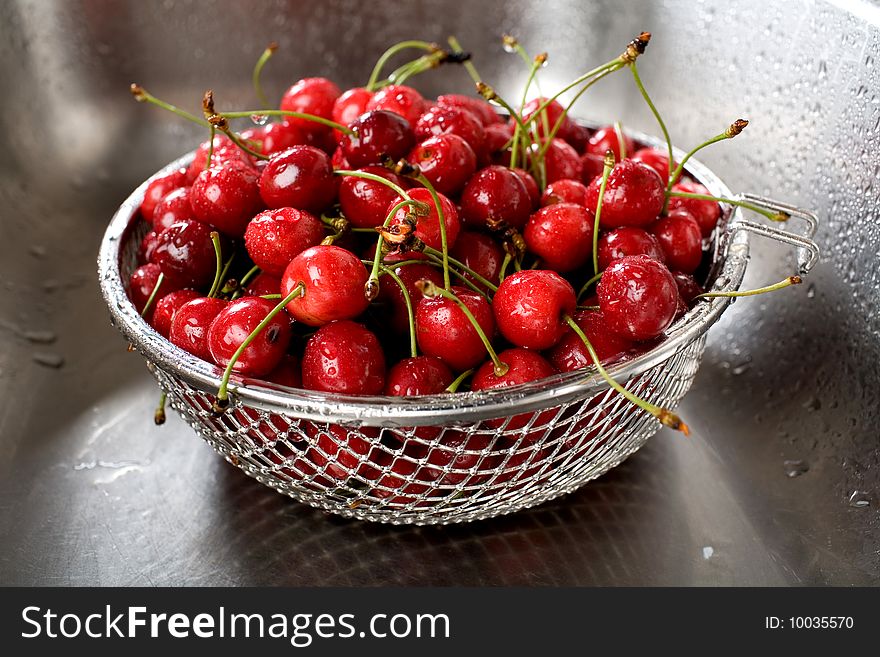 Wet fresh cherry in sink