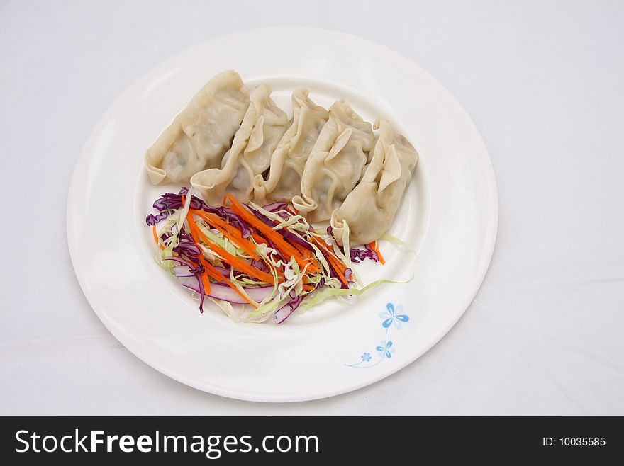 Fried Pork Dumplings on a dish with vegetable. Fried Pork Dumplings on a dish with vegetable.