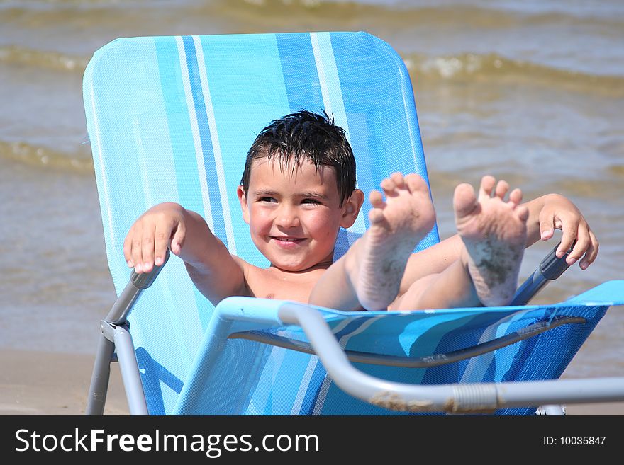 Cute little boy relaxing on the beach