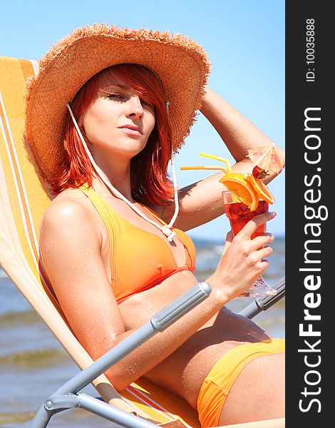 Young woman relaxing on beach. Young woman relaxing on beach