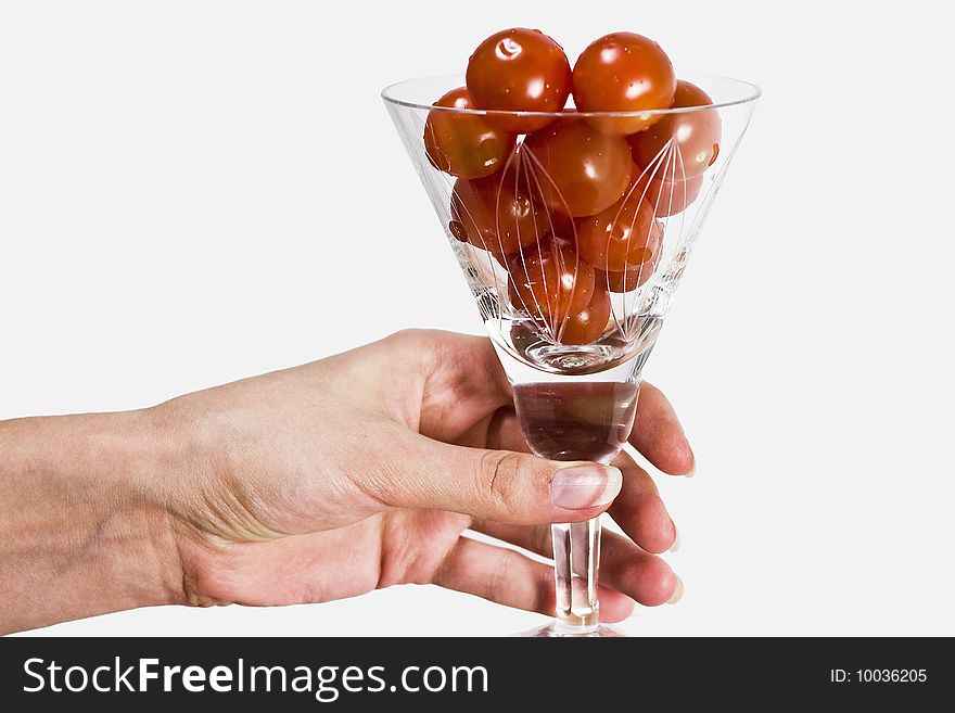 Small cherry tomato in martini vase. Small cherry tomato in martini vase