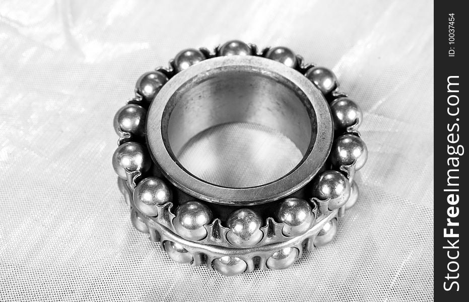 Ball bearing on silver background