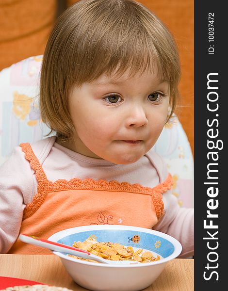 Sweet toddler baby girl eating